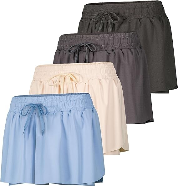 Real Essentials 4 Pack: Womens Flowy Dry Fit Running Short - Gym Yoga Workout Summer Shorts (Available in Plus Size)